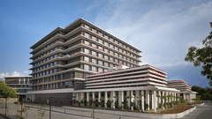 Multi storey hotel building exterior against a clear sky at The Residency Signature Madurai.
