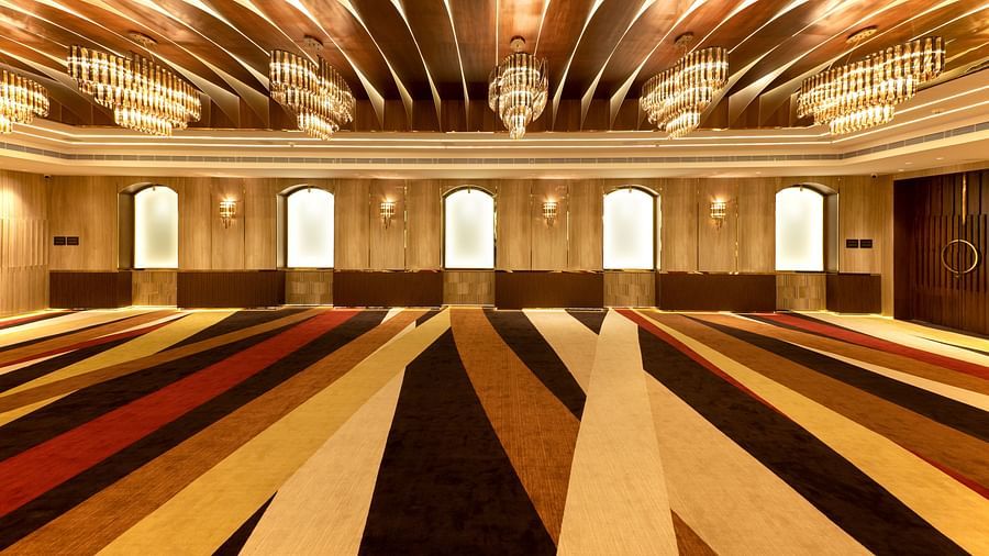 view of an empty hall with chandelier lights4