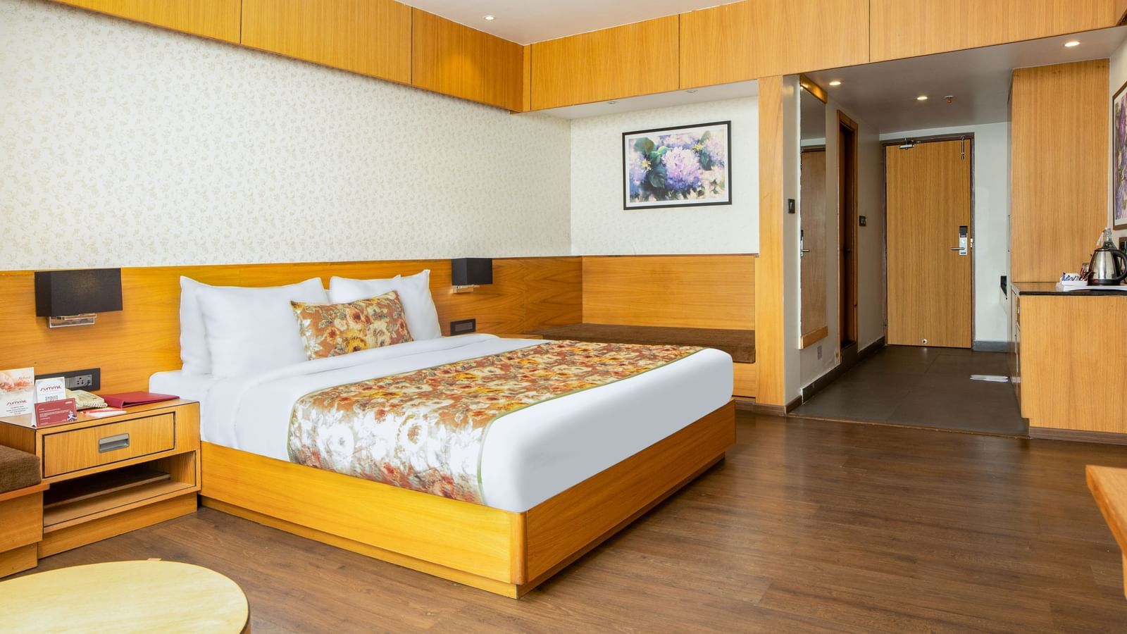 Premium Junior Suite with Sofa Cum Bed View Room with large bed, wall mounted televison and a big window with stunning nature view