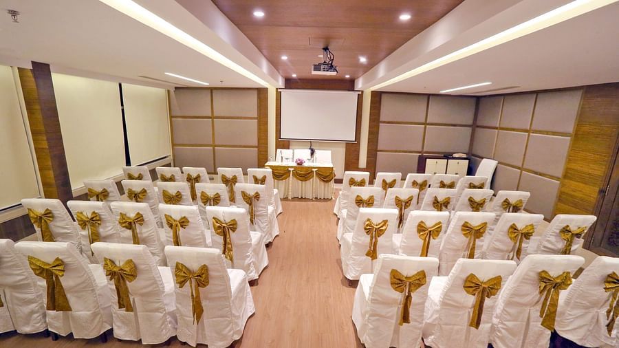 Banquet hall at Fragrant Nature Munnar, elegantly decorated with chairs and celebratory adornments