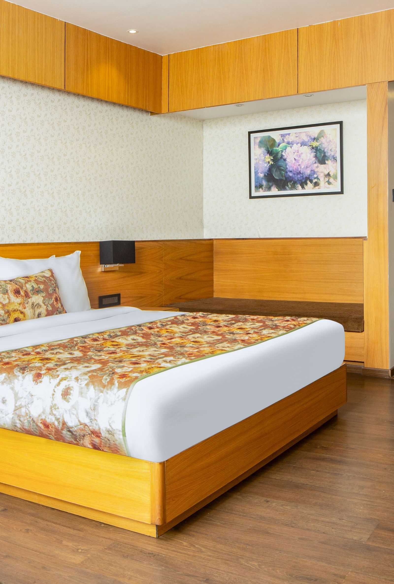 Premium Junior Suite with Sofa Cum Bed View Room with large bed, wall mounted televison and a big window with stunning nature view