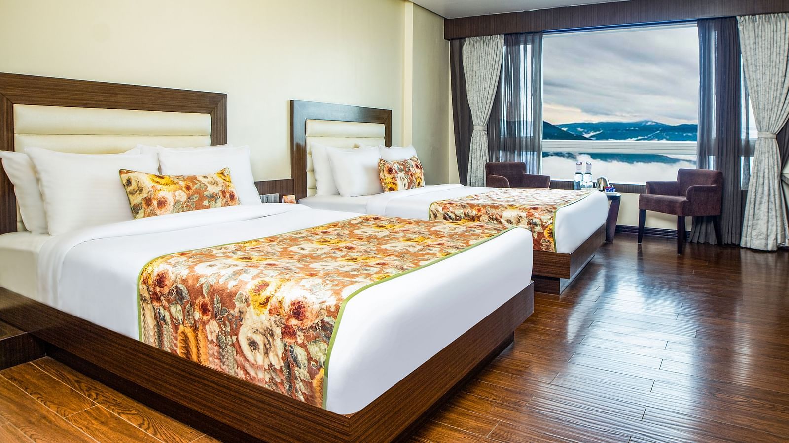 Family Suite View with spacious twin beds and wall mounted televison along with large windows
