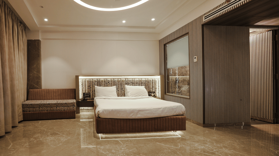 Modern room featuring twin beds and stylish decor at Kumar Resort by Turtle.