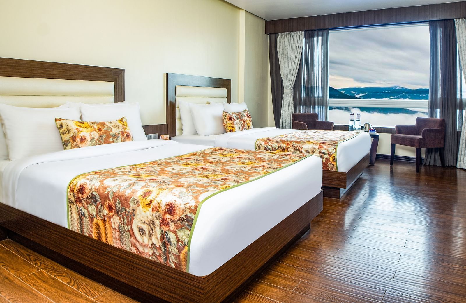 Family Suite View with spacious twin beds and wall mounted televison along with large windows