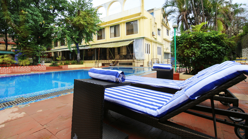The sun-bathing beds kept by the pool at our resort - Zara's Resort