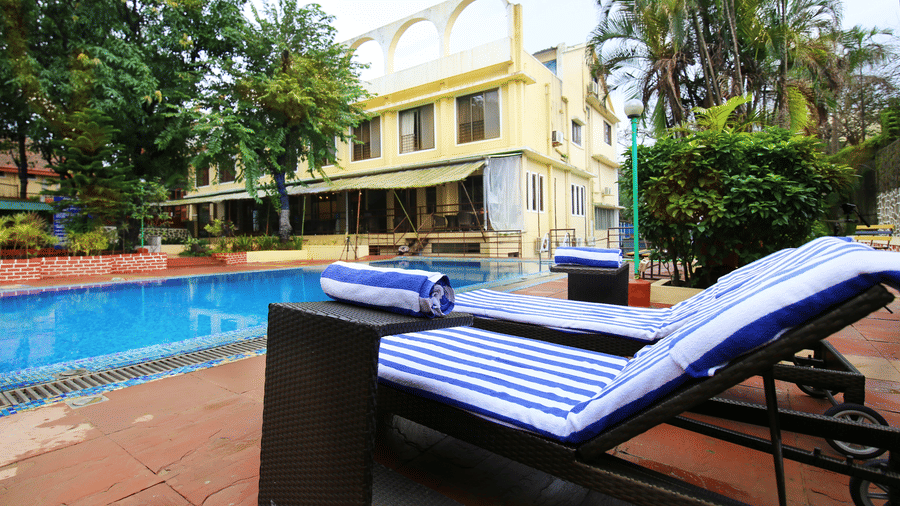 The sun-bathing beds kept by the pool at our resort - Zara's Resort