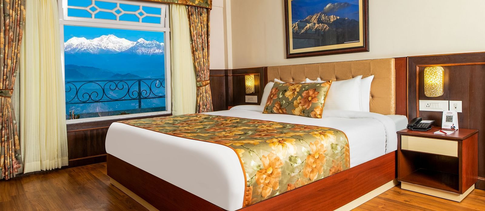 A side view of a bed in a room that has a glass window | Summit Oakden Resort & Spa, Mall Road
