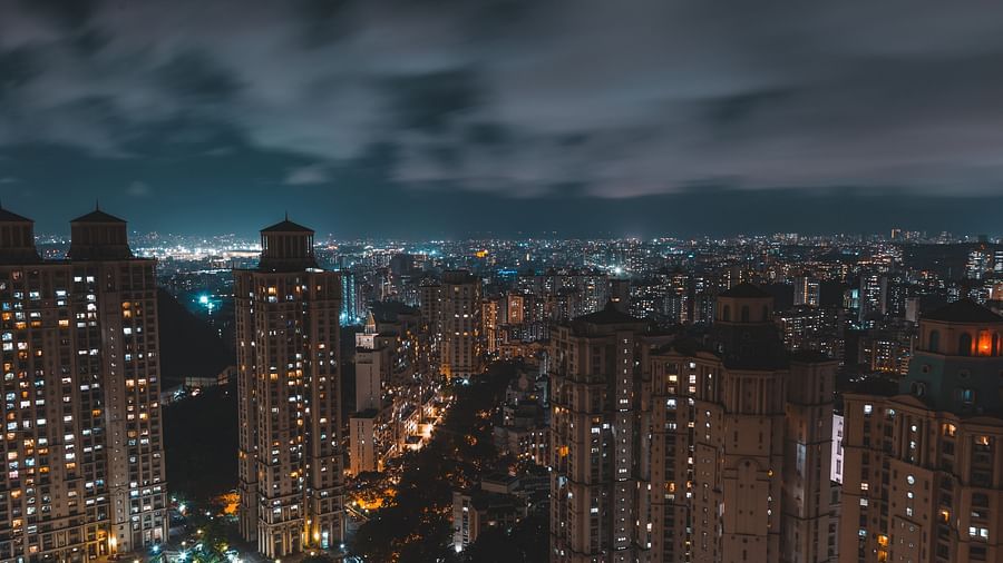 towering skyscrapers with well-lit windows at night