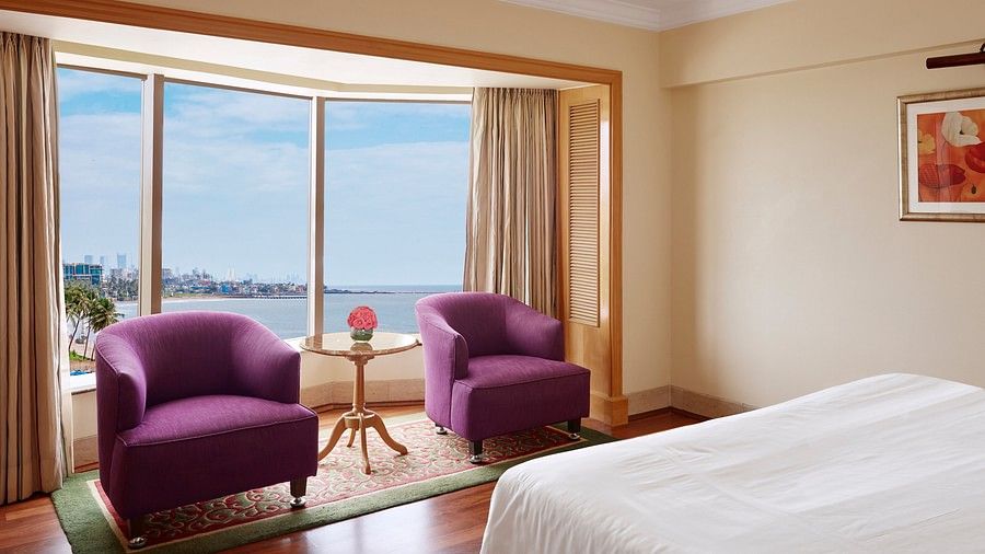 chairs one of the rooms at Ramada Plaza Palm Grove 8943
