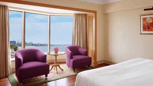 chairs in one of the rooms at Ramada Plaza Palm Grove