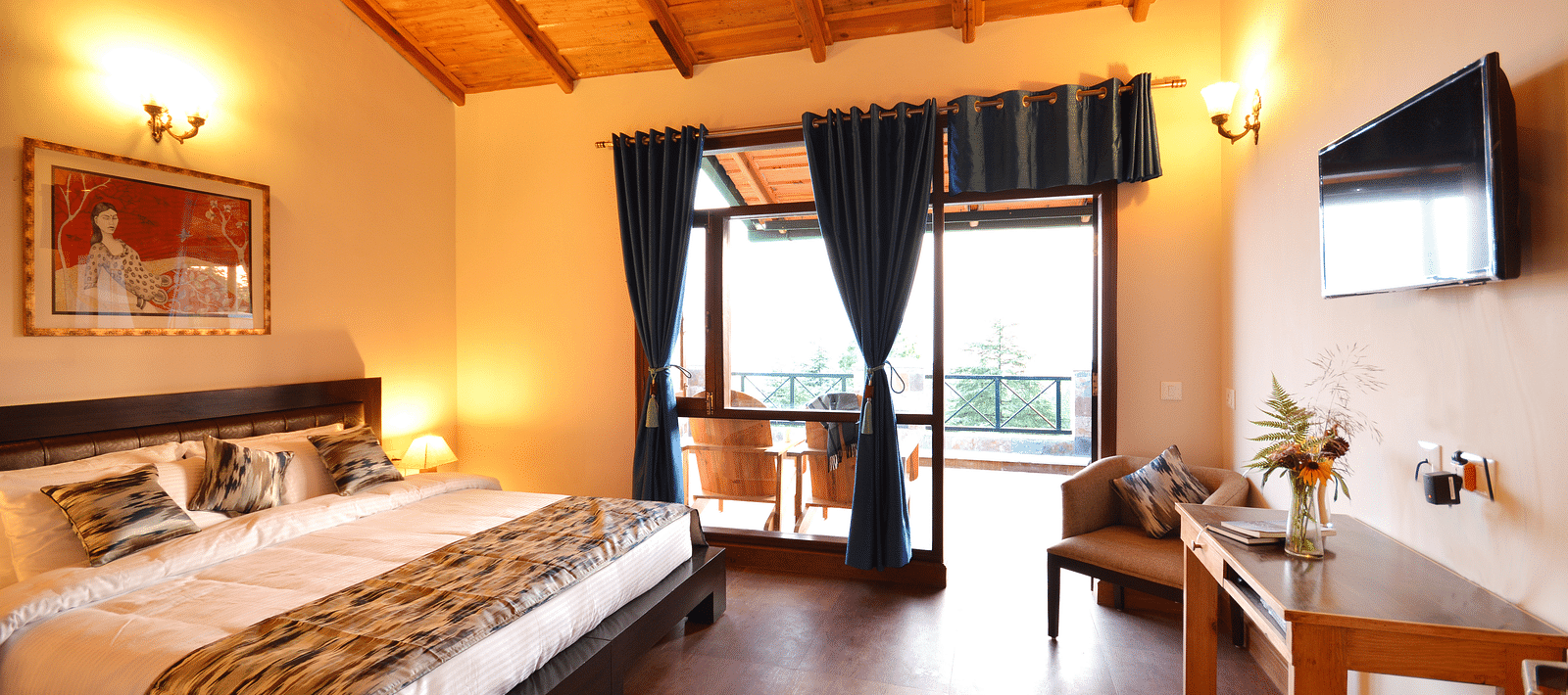 A warm and inviting bedroom in Almora with wooden interiors and ample natural light - BluSalzz Escapade - Anant Rasa Resort