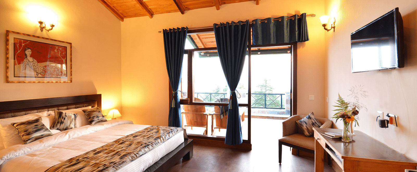A warm and inviting bedroom in Almora with wooden interiors and ample natural light - BluSalzz Escapade - Anant Rasa Resort