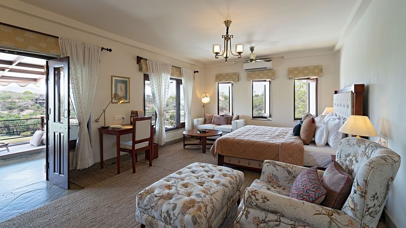 Overview of the Suite with a king bed and sofa, study table and futon - Chunda Shikar Oudi
