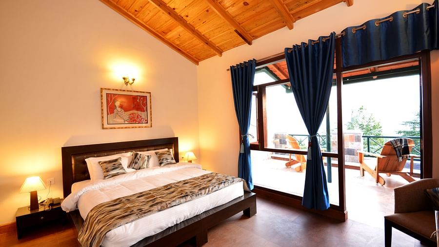 A beautifully designed room in almora with a king size bed and direct access to a private balcony - BluSalzz Escapade - Anant Rasa Resort