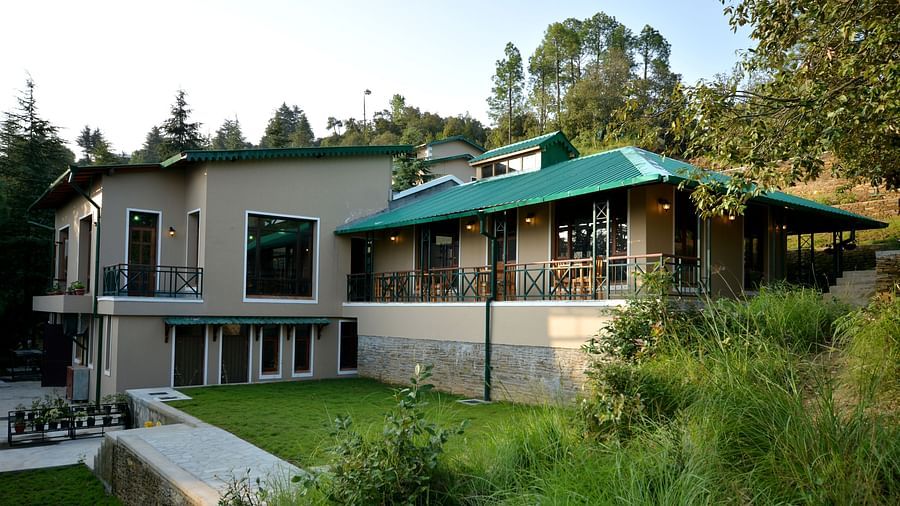 An image of our accommodation building with teal coloured tiles on the roof and surrounded by greenery - BluSalzz Escapade - Anant Rasa Resort