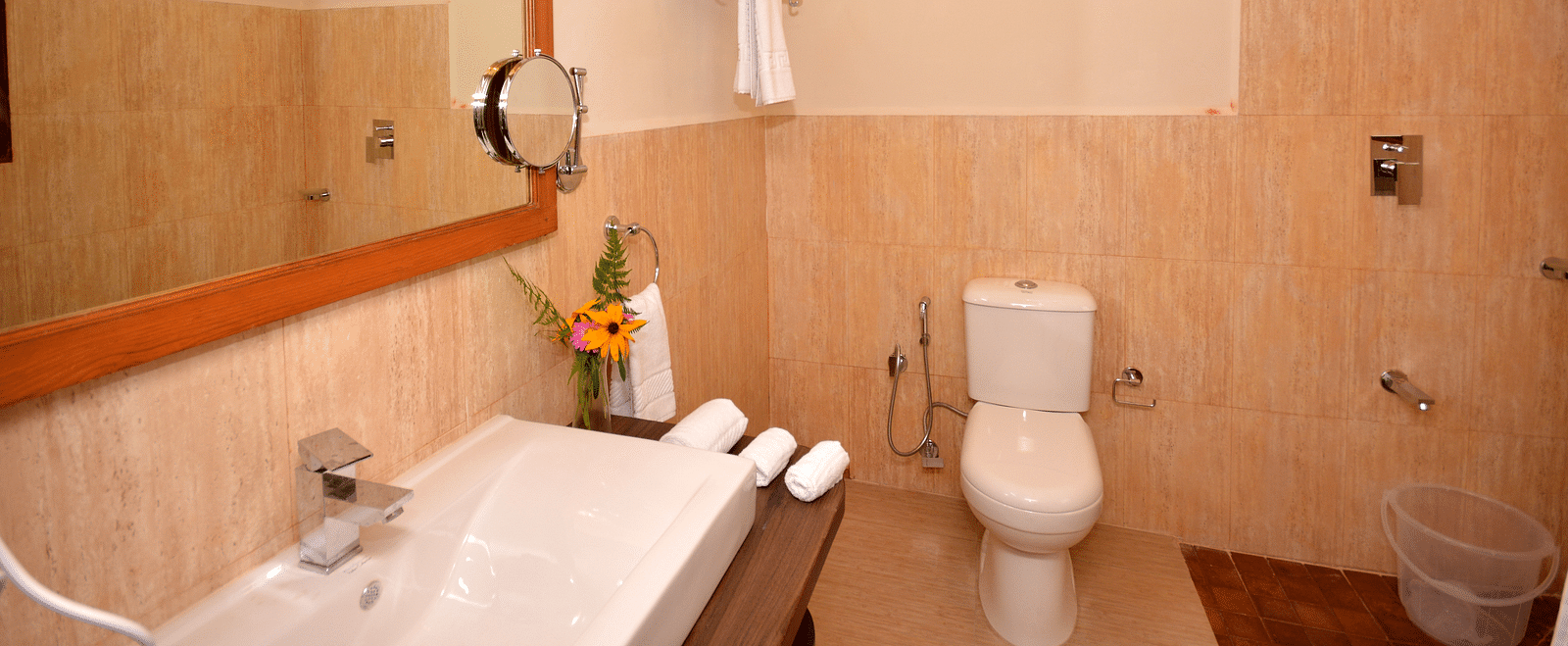 A modern bathroom featuring a vanity area, a mirror, and a clean shower area - BluSalzz Escapade - Anant Rasa Resort