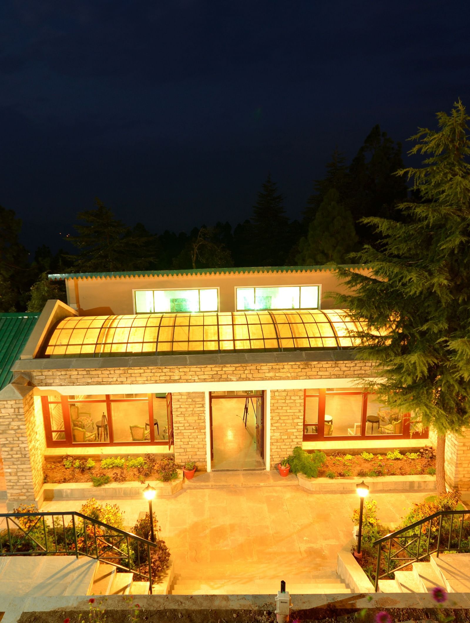 A stunning night view of the our dining area with glowing lights and serene surroundings - BluSalzz Escapade - Anant Rasa Resort