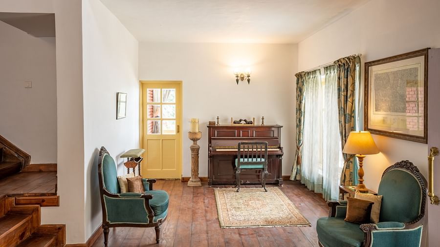 A living room with chairs and lights at Te Aroha By Shervani, Mukteshwar