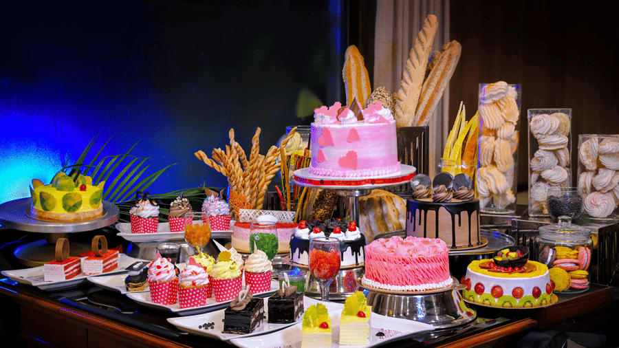 Cakes placed on a plate at a dining space at Clarks Hotels.