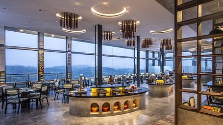 Elegant restaurant interior with a panoramic view and modern decor.