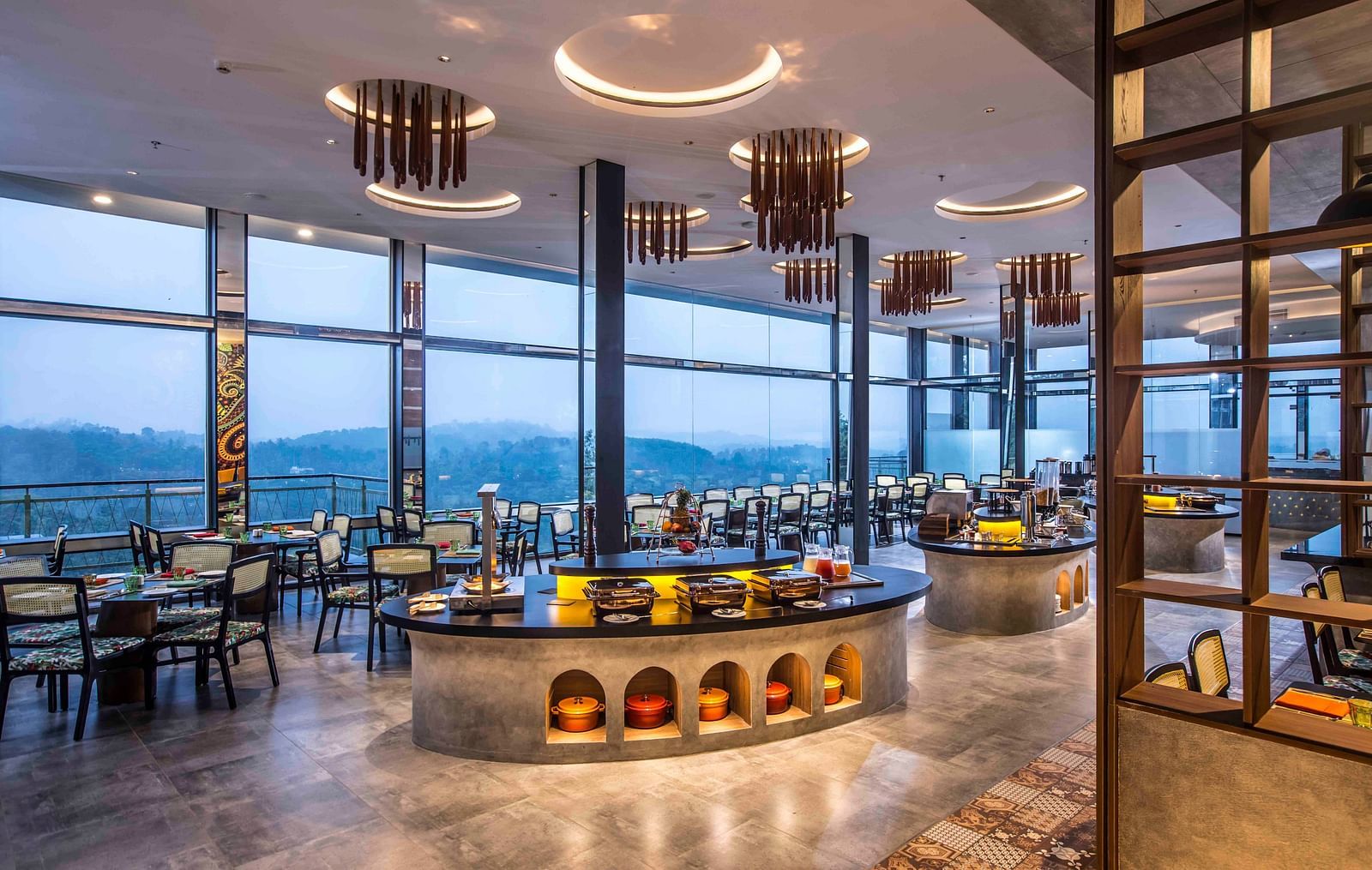 A wide angle shot of the in-house restaurant at our hotel | Great Trails Wayanad by  GRT hotels.