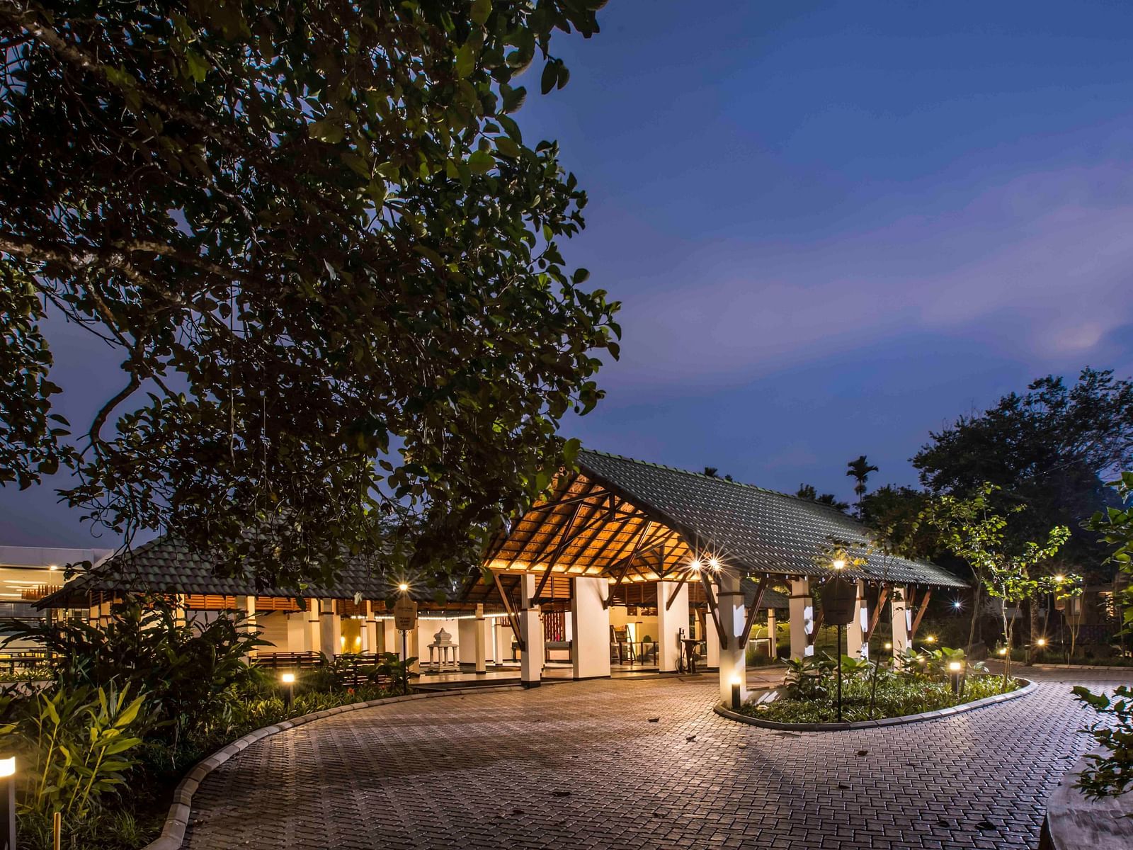 Image of the facade of the hotel during night Image of a well equipped washroom at out hotel| Great Trails Wayanad by  GRT hotels.