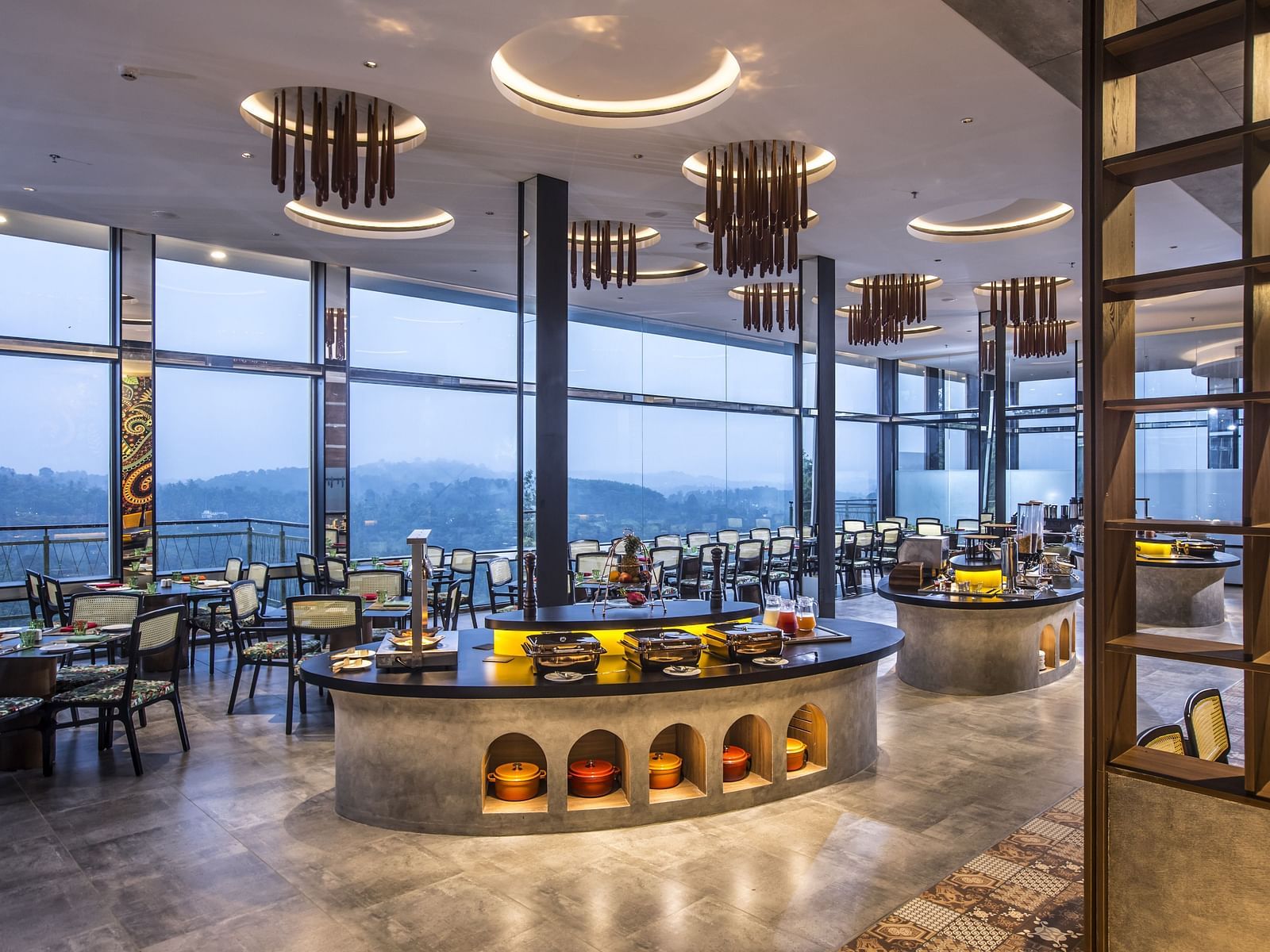 Elegant restaurant interior with a panoramic view and modern decor.