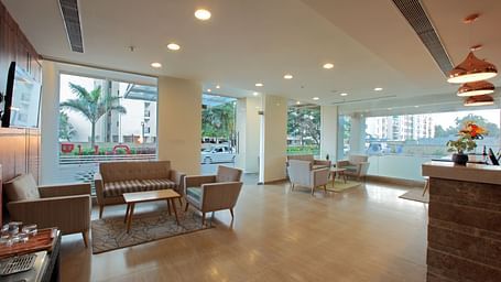 Seating arrangement in the lobby at Starlit Suites, Bangalore