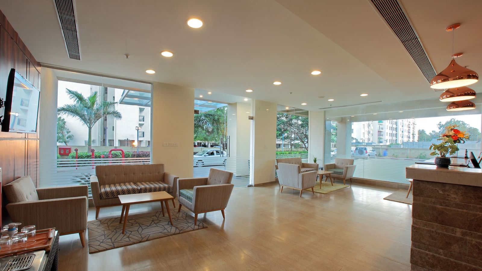 Seating arrangement in the lobby at Starlit Suites, Bangalore
