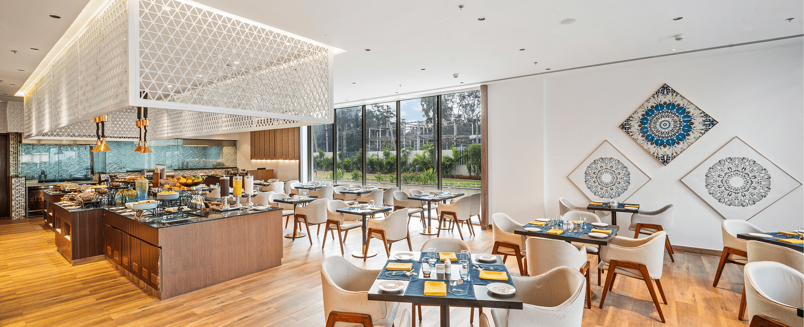 A dining setting at Grand Vijayawada Bazaar at Grand Vijayawada by GRT Hotels.