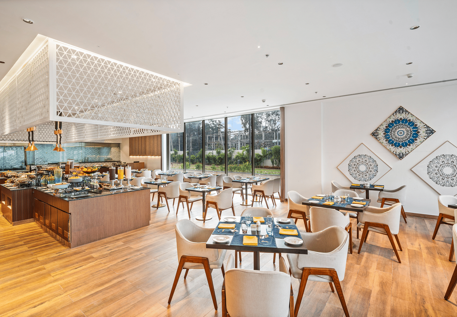A dining setting at Grand Vijayawada Bazaar at Grand Vijayawada by GRT Hotels.