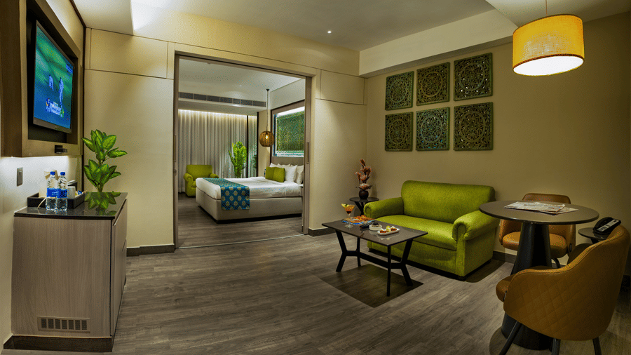 Stylish suite with living space, dining nook and modern furnishings at The Sonnet, Jamshedpur.