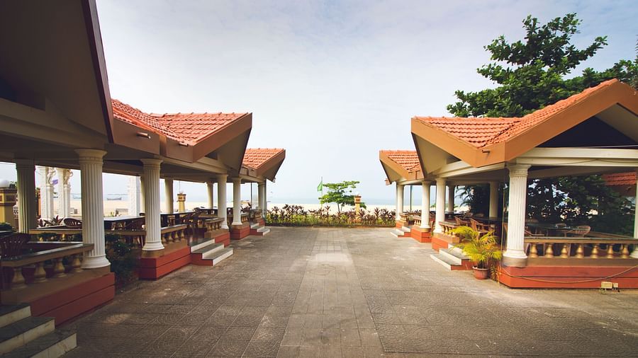 A view of the exterior of the beach-side restaurant at Paradise Isle Beach Resort, Udupi during the day