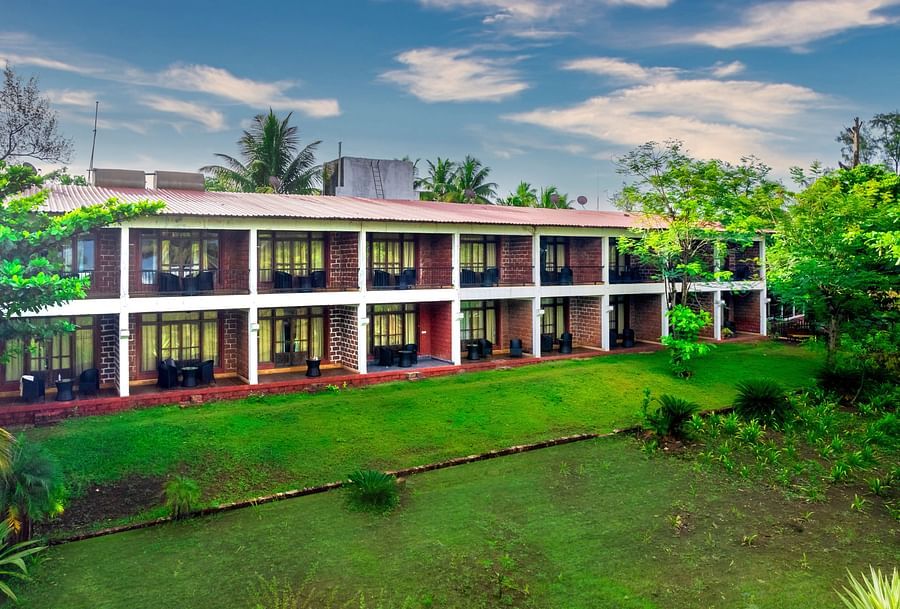 Lotus eco beach resort facade with garden in front