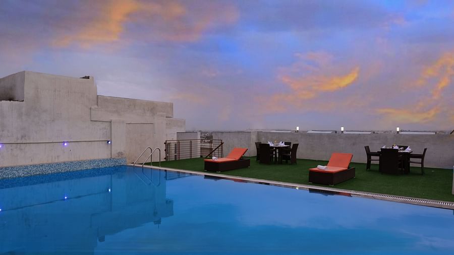 Rooftop Swimming pool with lounge chairs and a seating arrangement