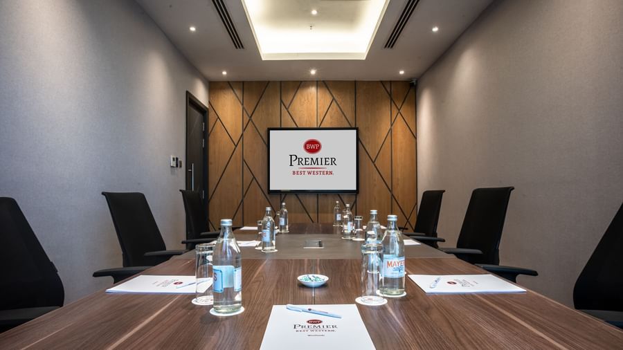 Boardroom at Best Western Premier Westlands set up for a meeting with water bottles, folders, and pens