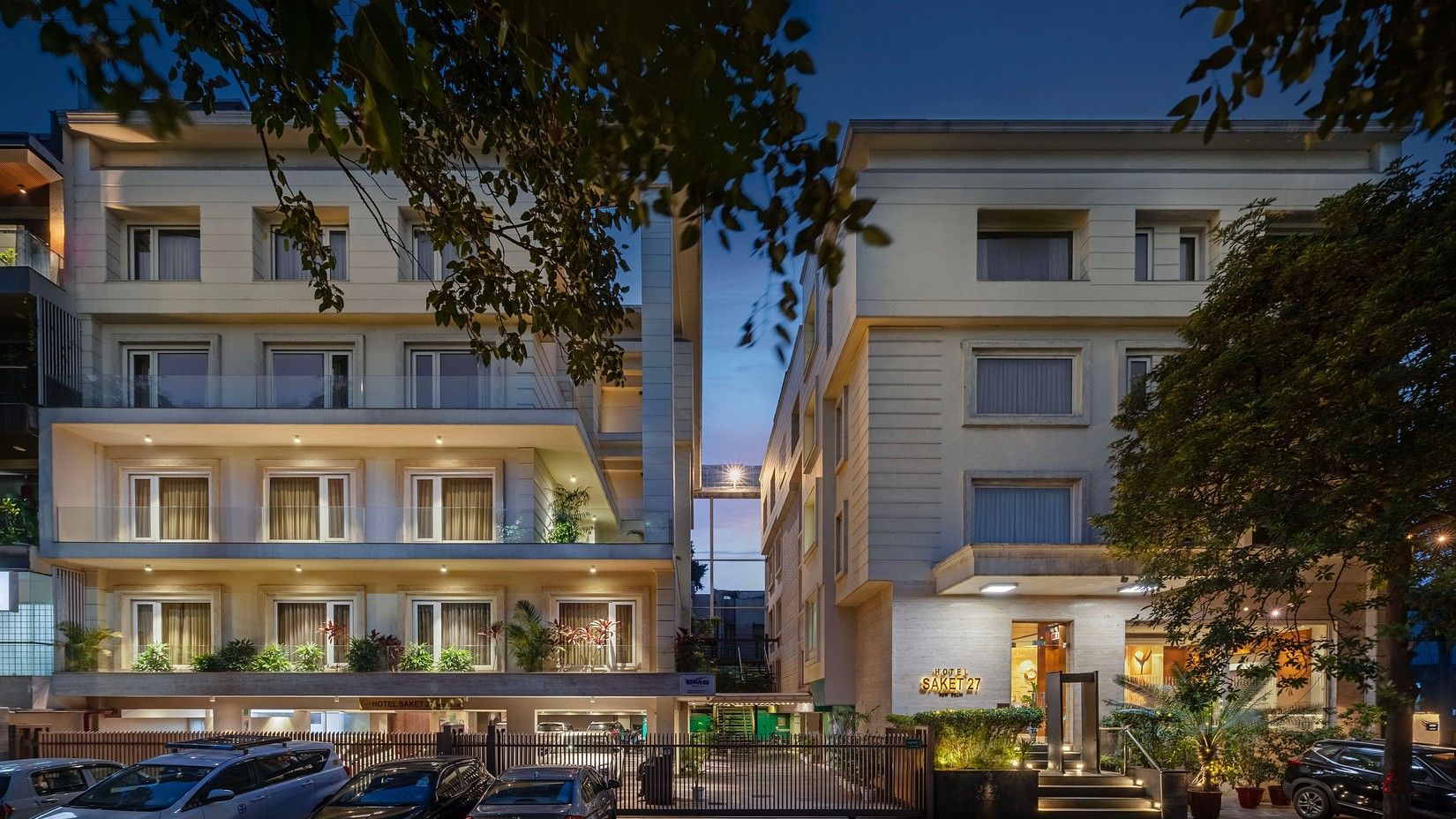 Exterior view of a well-lit hotel building at dusk