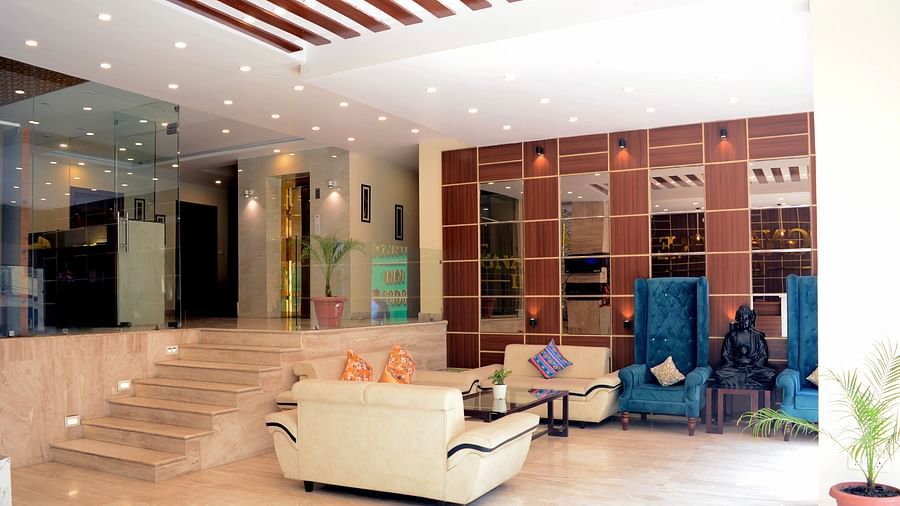 image of the lobby featuring a common seating area with staircase leading upstairs - ZENQ SIGNATURE INN, MCLEODGANJ