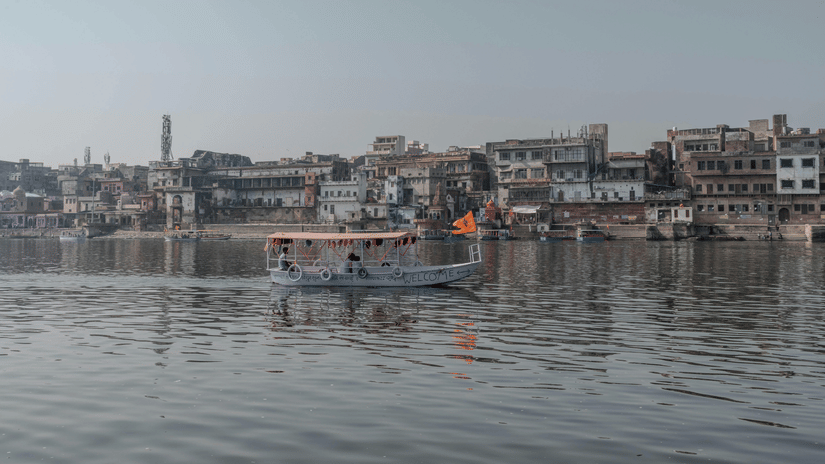 People sailing on a boat at Yamuna river.