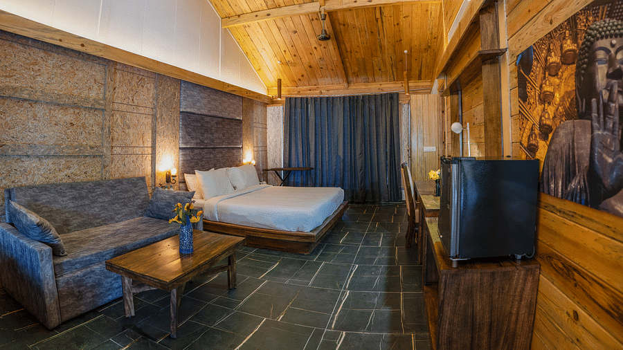 A view of the Master Suite with a large bed at the Sylvan Retreat, Dehradun.