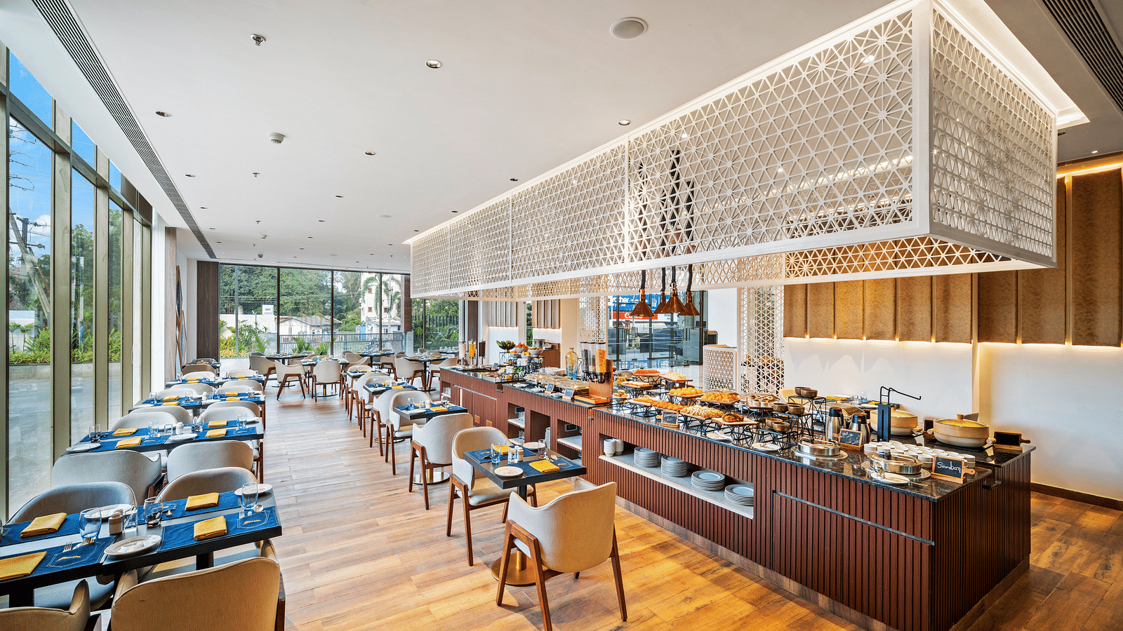A dining setting at Grand Vijayawada Restaurant at Grand Vijayawada by GRT Hotels.