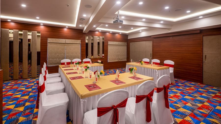 Boardroom setup with a U-shaped table arrangement prepared for a business meeting - Lords Eco Inn Shapar Rajkot