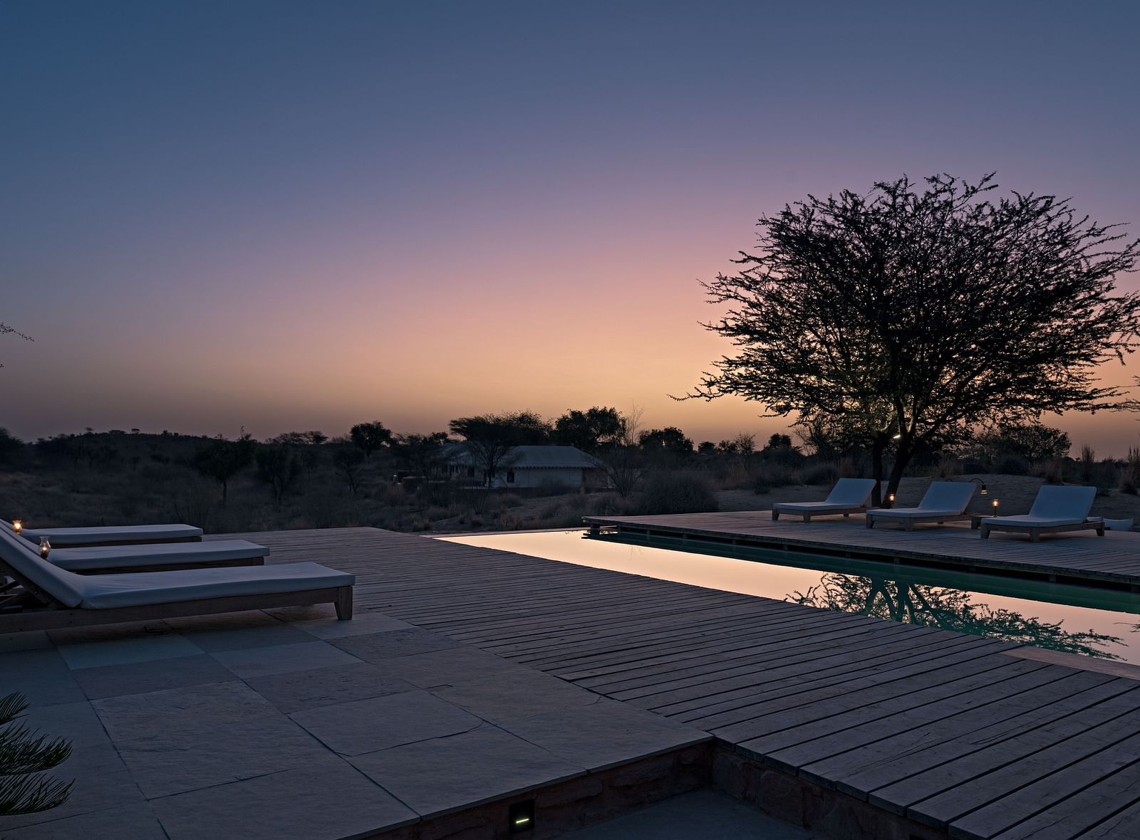 Swimming pool at Manvar Resort and Desert Camp during sunset