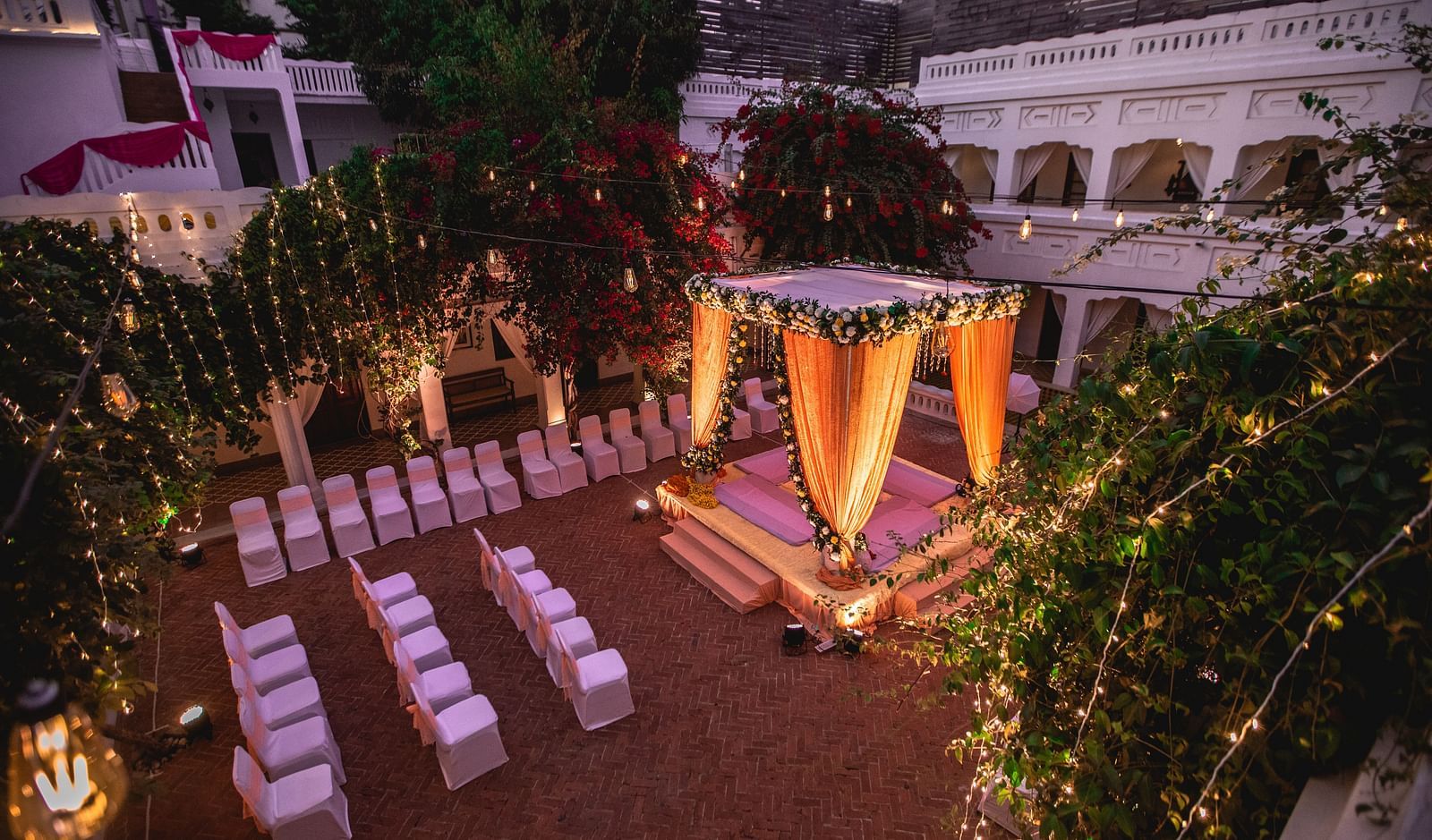 Sub-aerial view of a wedding arrangement made in the open area of Saraca Hotel, Lucknow at dusk