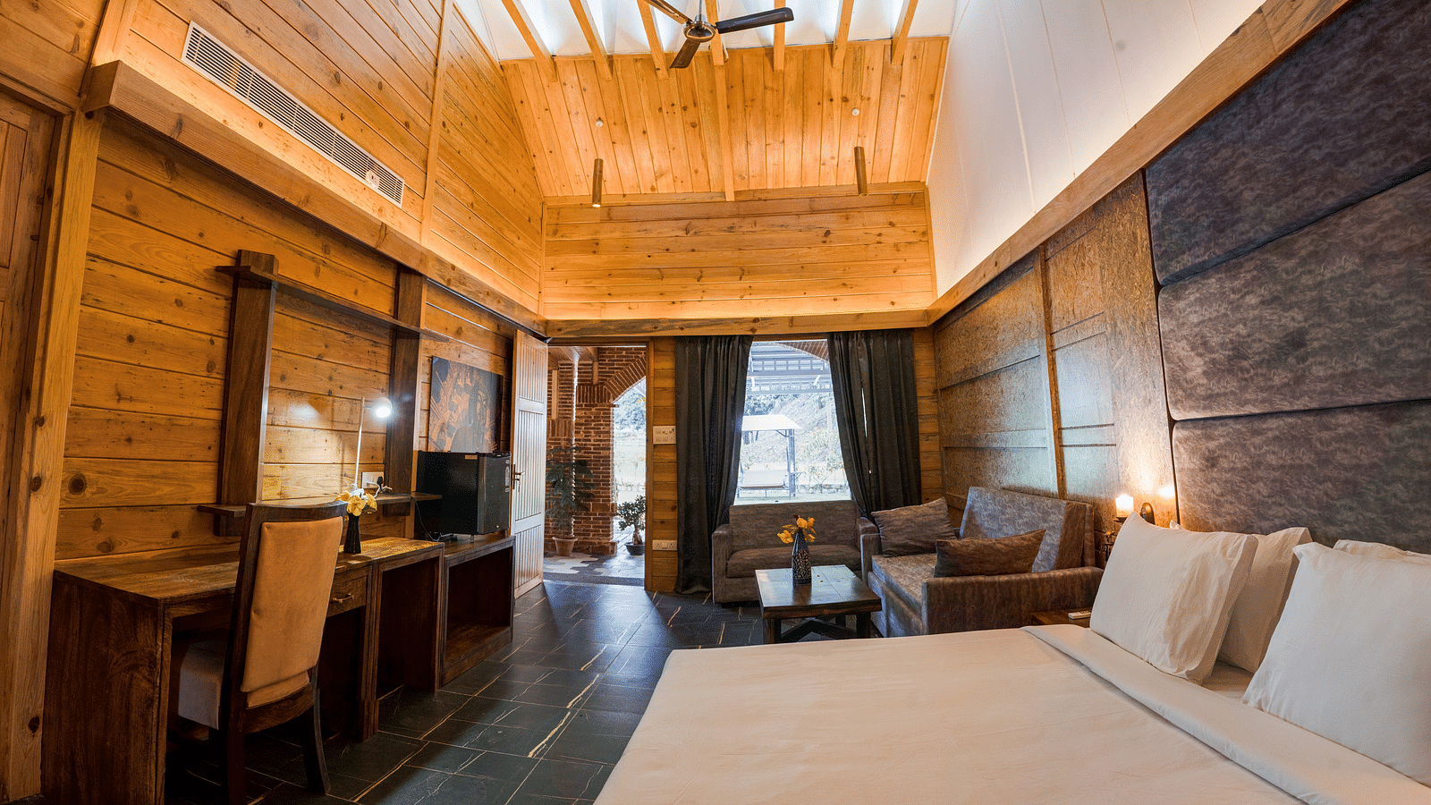 A view of the Master Suite with a large bed at the Sylvan Retreat, Dehradun.
