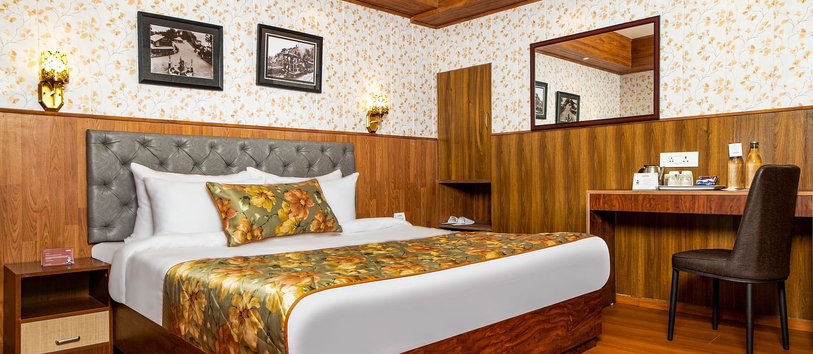 A bed in a room that has a chair and work desk | Summit Oakden Resort & Spa, Mall Road