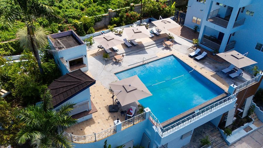 An aerial image of a rooftop pool surrounded by greenery on all sides - Hotel 39, Jamaica (Montego Bay)