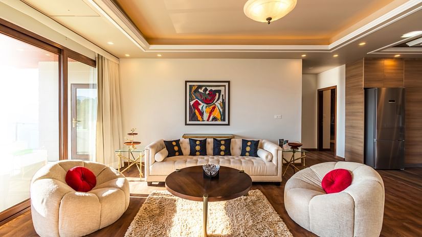 The Manor Shimla - Interiors of the living area of the standard luxury room with a set of off white sofa