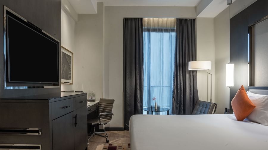 Spacious SUPERIOR with living area, flat-screen TV, and sophisticated furnishings at Best Western Premier Westlands hotel.
