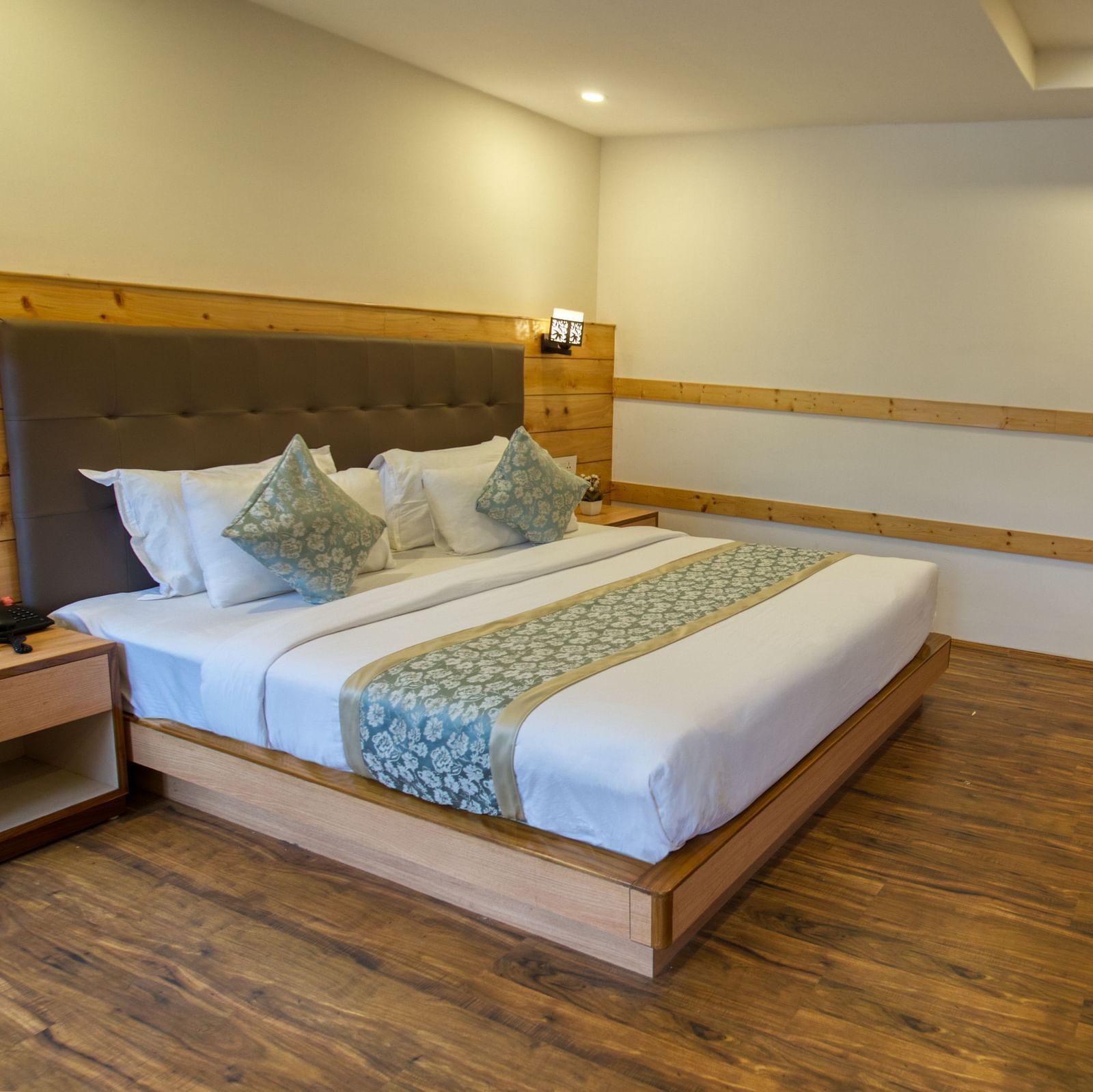 A image of the family suite with bed and TV in front I Avianna Gangtok Prime Hotel & Spa